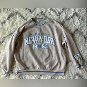 Cream and light blue crew neck